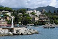 Santa Margherita sculpture and Pastel-coloured Buildings in Harbour at Santa Margherita Ligure, Genoa, Italy.