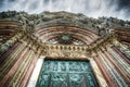 Santa Maria Assunta cathedral in Siena under a dramatic sky