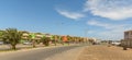 SANTA MARIA, CABO VERDE - NOVEMBER 29, 2017: street with palms and colored apartments across hotels in Santa Maria