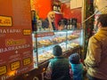 Santa Maria da Feira, Portugal - december 2 2023. Children window shopping on traditional Perlim Christmas market in Santa Maria