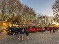 Santa Maria da Feira, Portugal - December 2, 2023. Christmas train transporting families at the Perlim Christmas Market near the