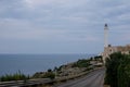 Santa Maria di Leuca, Italy. Iconic lighthouse located next to Basilica De Finibus Terrae where the Adriatic and Ionian seas meet. Royalty Free Stock Photo