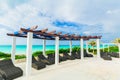 inviting view of Golden Tulip hotel swimming pool area on the beach and tranquil turquoise ocean background Royalty Free Stock Photo