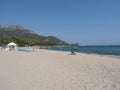 Santa Maria Navarrese, Sardinia, Italy, September 18, 2020: Sand beach Spiaggia di Santa Maria Navarrese with few sunbathing Royalty Free Stock Photo