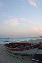 Colorful wooden fishing boats on the beach in Sal in Cape Verde at sunset Royalty Free Stock Photo