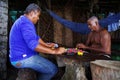 SANTA MARTA, COLOMBIA, 18 AUGUST, 2018: Fishermen playing checkers on Costeno Beach