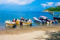 SANTA MARTA, COLOMBIA - OCTOBER 10, 2017: Unidentified tourists sailing in a boat in a caribean beach. Taganga, Colombia Royalty Free Stock Photo