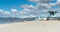 Santa Monica Beach lifesavers lookouts towers and pier in dista