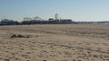 SANTA MONICA, LOS ANGELES CA USA - 19 DEC 2019 Alone anonymous man looks like unemployed and homeless sleeping on beach sand.