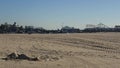 SANTA MONICA, LOS ANGELES CA USA - 19 DEC 2019 Alone anonymous man looks like unemployed and homeless sleeping on beach sand.