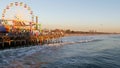 SANTA MONICA, LOS ANGELES CA USA - 19 DEC 2019: Classic ferris wheel in amusement park on pier. California summertime beach