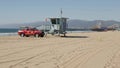 SANTA MONICA, LOS ANGELES CA USA - 28 OCT 2019: California summertime beach aesthetic. Iconic blue wooden watchtower, red Royalty Free Stock Photo