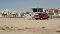 SANTA MONICA, LOS ANGELES CA USA - 28 OCT 2019: California summertime beach aesthetic. Iconic blue wooden watchtower, red