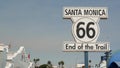 SANTA MONICA, LOS ANGELES, USA - 28 OCT 2019: Historic route 66, famous vintage california trip symbol. Pier of pacific ocean