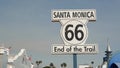 SANTA MONICA, LOS ANGELES, USA - 28 OCT 2019: Historic route 66, famous vintage california trip symbol. Pier of pacific ocean