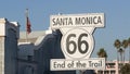 SANTA MONICA, LOS ANGELES, USA - 28 OCT 2019: Historic route 66, famous vintage california trip symbol. Pier of pacific ocean Royalty Free Stock Photo