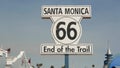 SANTA MONICA, LOS ANGELES, USA - 28 OCT 2019: Historic route 66, famous vintage california trip symbol. Pier of pacific ocean Royalty Free Stock Photo