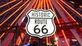 SANTA MONICA, LOS ANGELES, USA - 28 OCT 2019: Iconic road sign glowing, historic route 66. Famous california symbol, pier of Royalty Free Stock Photo