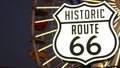 SANTA MONICA, LOS ANGELES, USA - 28 OCT 2019: Iconic road sign glowing, historic route 66. Famous california symbol, pier of Royalty Free Stock Photo