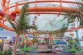 Santa Monica Pier fairground and attractions with people moving