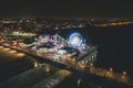 Santa Monica Pier at Night in super colourful lights from Aerial Drone perspective in Los Angeles