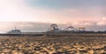 Santa Monica Pier at sunset - artistic shot captured during the golden hour