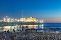 people enjoy the ocean park at Santa Monica pier by night Royalty Free Stock Photo