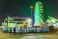 people enjoy the ocean park at Santa Monica pier by night Royalty Free Stock Photo