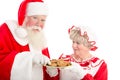 Santa and Mrs Claus with plate of cookies Royalty Free Stock Photo