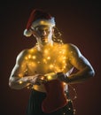 Santa with muscular body in garland.