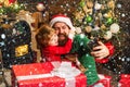 Christmas family in snow. Santa and old bearded Santa using smartphone. Winter Christmas emotion. Internet, wireless and