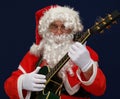 Santa playing christmas carols