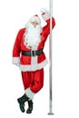 Santa is pole dancer, lean on a pylon. Smiling Santa Claus dancing with pole on white background. Christmas coming Royalty Free Stock Photo