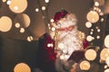 Santa reading a book in warm home atmosphere