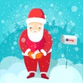 Santa in red costume holds letter stands near Royalty Free Stock Photo