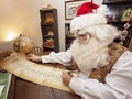 Santa Reviews His Toy List Royalty Free Stock Photo