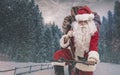 Santa riding a bicycle and carrying gifts Royalty Free Stock Photo