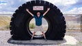 Traveler poses at landmark roadside attraction