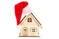 Santa`s hat on model of house. Isolated on white Royalty Free Stock Photo