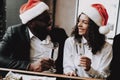 Santa`s Hat. Young People. Rest. Emotion. Bar. Royalty Free Stock Photo