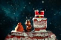 Santa`s legs are sticking out of the chimney. Funny plasticine deer sits nearby