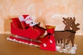 Santa`s sack that moves towards the sled and goes inside