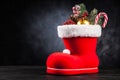 Santa`s shoe on dark background Royalty Free Stock Photo