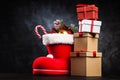 Santa`s shoe on dark background Royalty Free Stock Photo