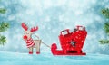 Santa`s sleigh full of gifts in snow. Deer pulls the sled. Cute wooden toy