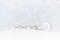 Santa`s sleigh in snow on white christmas background with bokeh Royalty Free Stock Photo