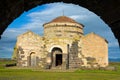 Santa Sabina Church framed by an archway in Sardinia, Italy