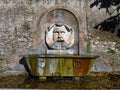 Santa Sabina, mask fountain in Rome , Italy Royalty Free Stock Photo