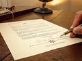 Santa Signs His Name on a Letter Royalty Free Stock Photo