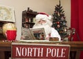 Santa Relaxes with a Magazine Royalty Free Stock Photo